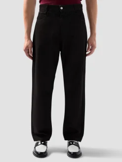 Pantalone jeans 5 tasche in denim trattato