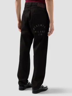 Pantalone jeans 5 tasche in denim trattato